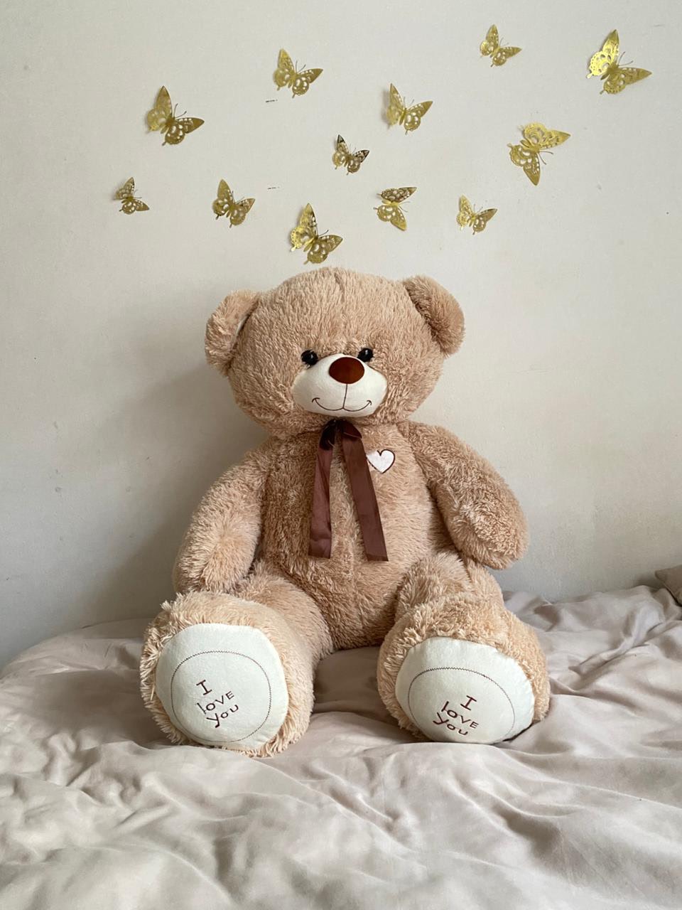 Pink teddy bear with bouquet